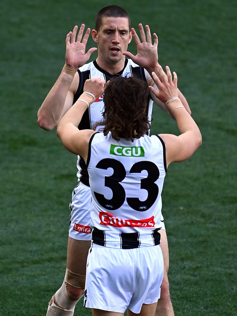 Darcy Cameron is congratulated by teammate Jack Ginnivan after a goal.