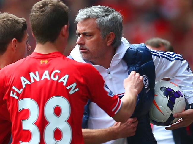 LIVERPOOL, ENGLAND - APRIL 27: (EDITORS NOTE: Retransmission of image 487057275 with alternate crop.) Steven Gerrard and Jon Flanagan of Liverpool have words with Jose Mourinho manager of Chelsea as he holds onto the ball during the Barclays Premier League match between Liverpool and Chelsea at Anfield on April 27, 2014 in Liverpool, England. (Photo by Clive Brunskill/Getty Images)