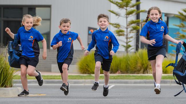 Torquay Coast Primary School students race back to their classrooms. Picture: Jay Town