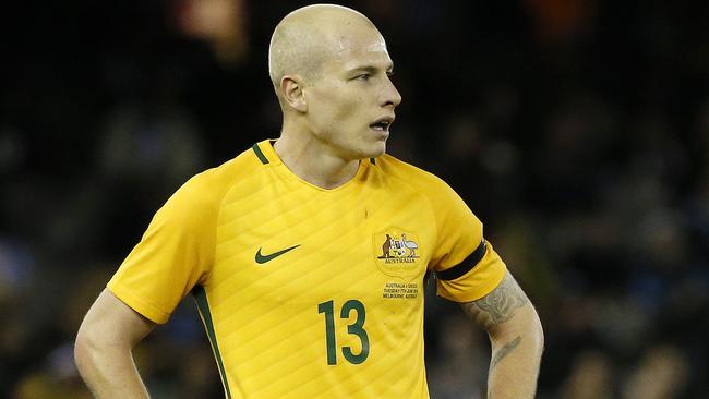 Aaron Mooy playing for the Socceroos against Greece.