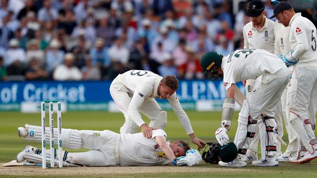 Steve Smith lies on the pitch after being hit by a ball from Jofra Archer. Picture: AFP