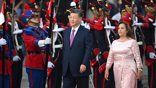 China's President Xi Jinping receives military honours next to Peru's President Dina Boluarte upon his arrival at the government palace in Lima, on the sidelines of the APEC summit. Picture: AFP