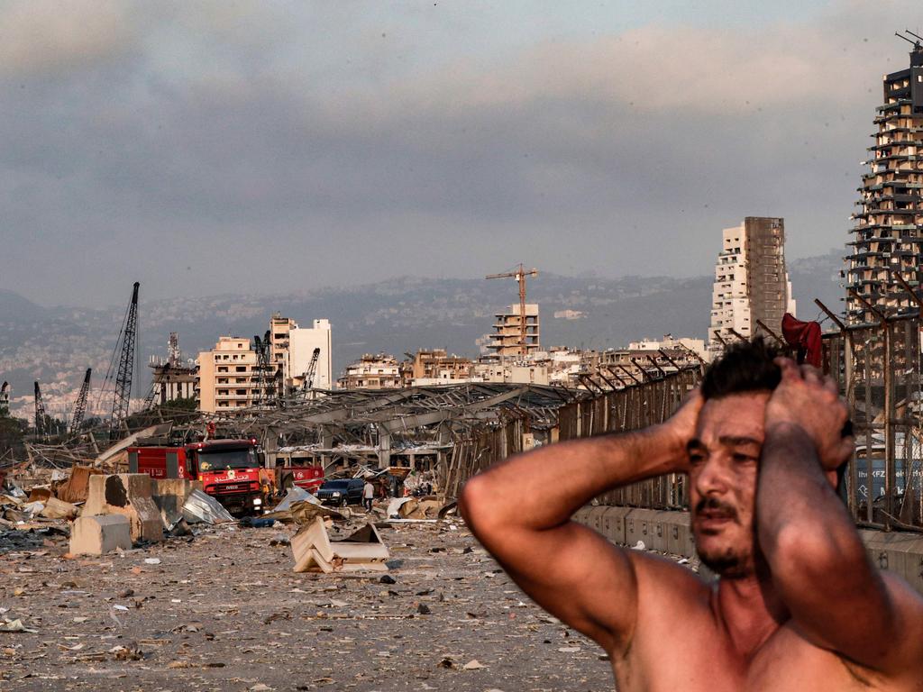 A man holds his head in his hands shortly after. Picture: Ibrahim Amro/AFP