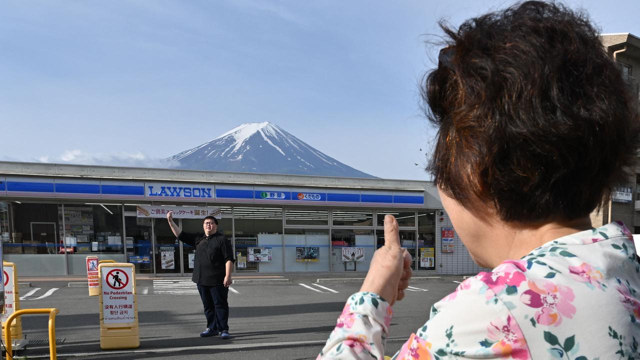 Officials were fed up with foreign visitors stopping there to take pictures of the view, and reportedly littering, trespassing and breaking traffic rules. Picture: Kazuhiro Nogi / AFP