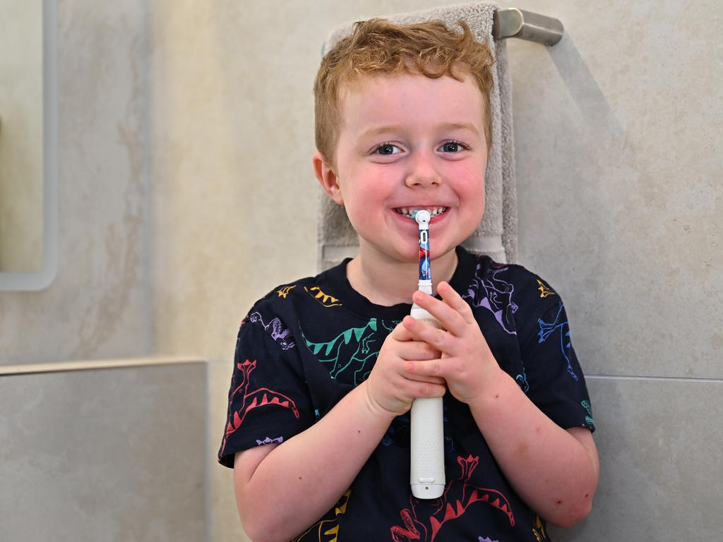 Hamish Thorpe practises his tooth brushing. Picture: Emily Barker