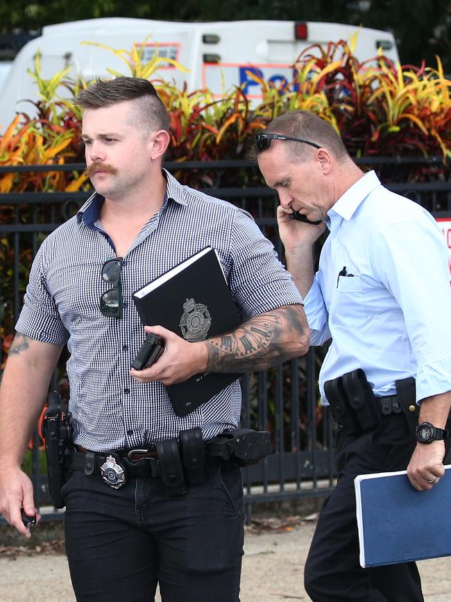 Police officers outside Hambledon State School. Picture: Brendan Radke