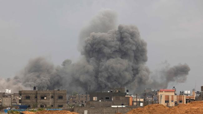 Smoke rises over in Khan Younis during Israeli bombardment on Friday. Picture: AFP