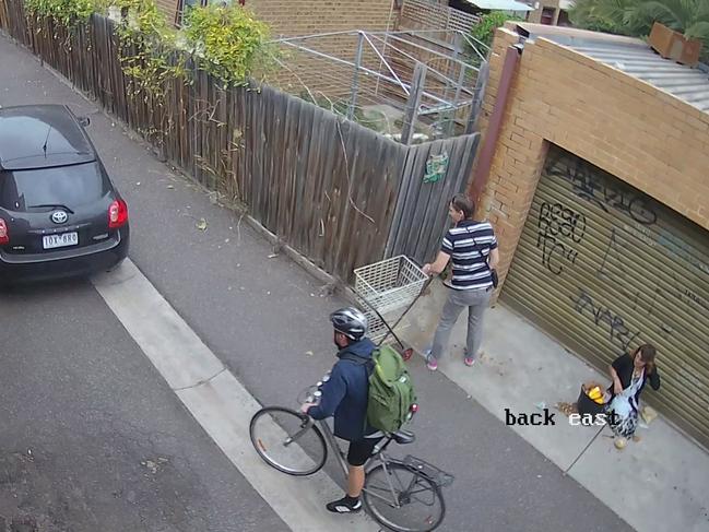 People pass through a Richmond laneway while drug users shoot up. Picture: Supplied