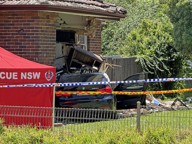 SYDNEY, AUSTRALIA - NewsWire Photos - 13 JANUARY, 2025: A woman has died in a single-vehicle crash in Sydney’s west today. About 10.30am (Monday 13 January 2025), emergency services were called to Punchbowl Road, Belfield, following reports of a crash. Officers attached to Auburn Police Area Command attended and found a vehicle had crashed into a house. The female passenger of the car was trapped for some time before being freed. She was treated at the scene by NSW Ambulance paramedics, however, died at the scene. Picture: NewsWire / Gaye Gerard