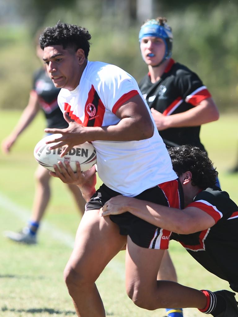 Boys Rugby League State Championship held at Northern Division, Brothers Leagues ground, Townsville. South West (black) v Wide Bay (white). 16-18 years. Noah Law of Shalom College.