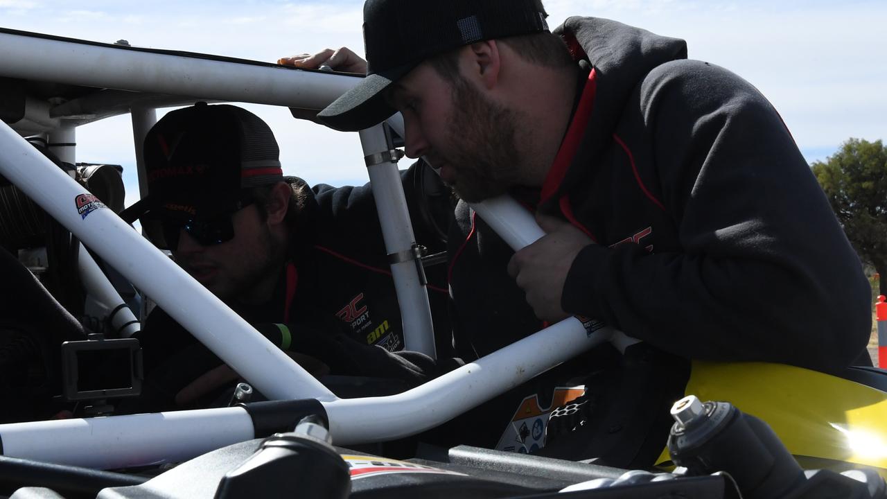 Mechanic Josh Bennett and team make the final adjustments to GRC Motorsports Can-Am Maverick 200cc. Picture: (A)manda Parkinson