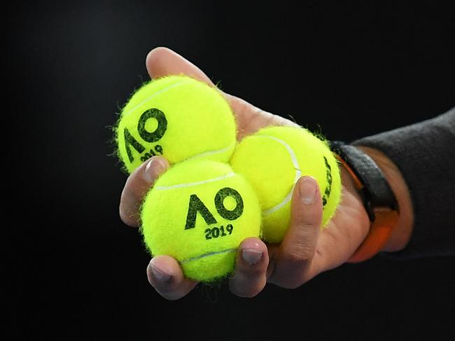 Rafael Nadal holds yellow tennis balls. Picture: AAP Image/Lukas Coch