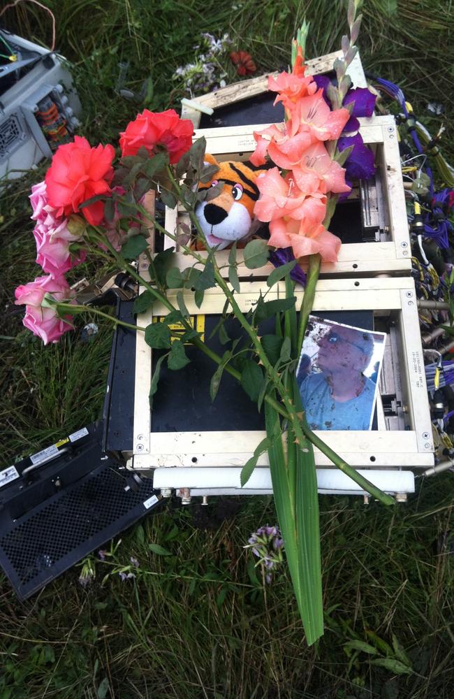 Photos and laptops found at scene become makeshift memorials. Picture: Supplied