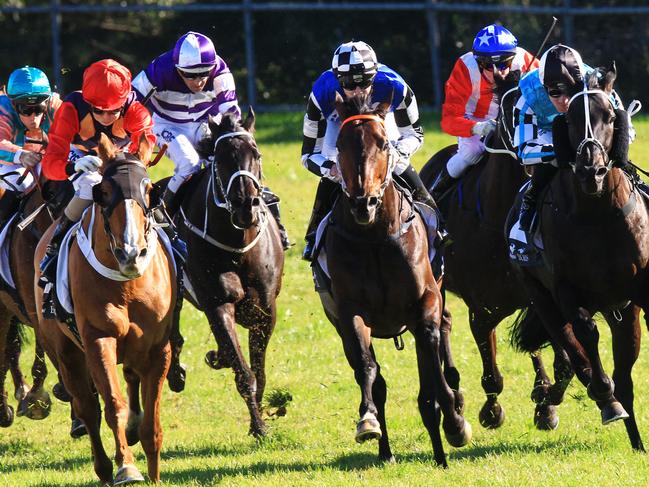 Song and laughter (last at the bend LHS) wins race during Canterbury Races in Sydney. Pic Jenny Evans