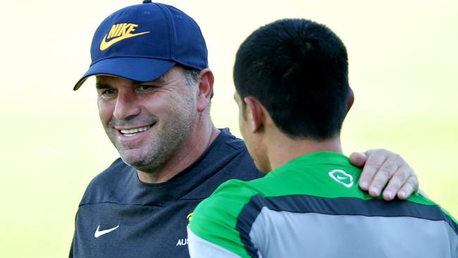 Socceroos coach Ange Postecoglou talks with Tim Cahill during Socceroos training at No. 2 Sports Ground,Newcastle .Picture Gregg Porteous