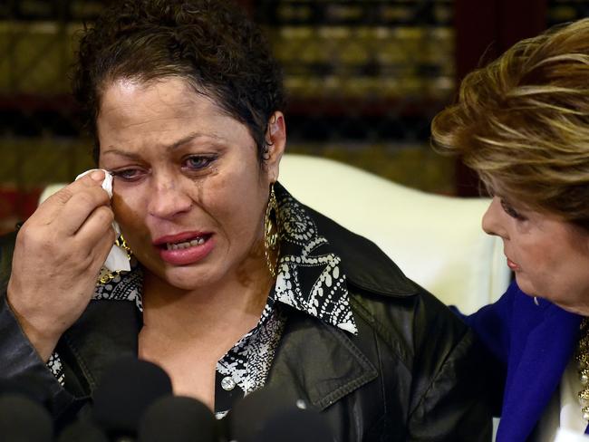 Aftermath ... Women's rights attorney Gloria Allred, right, comforts Chelan, an alleged victim of Cosby. Picture: Frederic J. Brown/AFP