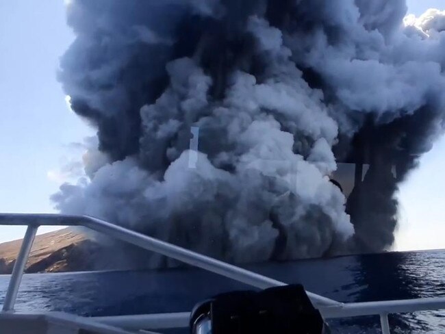 The tour group looks on in horror as smoke spews from the volcano. Picture: Supplied