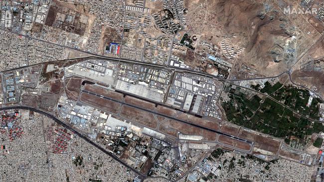 This satellite image released by Maxar Technologies shows an overview of Kabul’s Hamid Karzai International Airport as the chaos unfolds. Picture: AFP