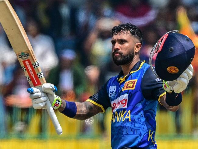 Sri Lanka's Kusal Mendis celebrates after scoring a century (100 runs) during the second and last one-day international (ODI) cricket match between Sri Lanka and Australia at the R. Premadasa International Cricket Stadium in Colombo on February 14, 2025. (Photo by Ishara S. KODIKARA / AFP)