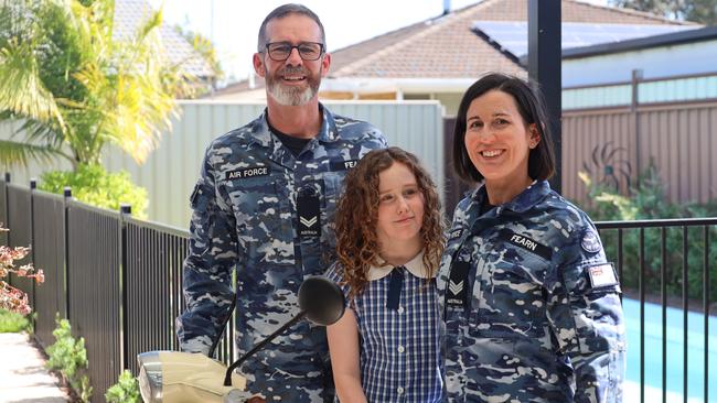 RAAF family Corporal Rob Fearn and Sergeant Stephanie Fearn, with 10-year-old daughter Sarah, at their home outside RAAF Base Richmond. Picture: Charles Miranda