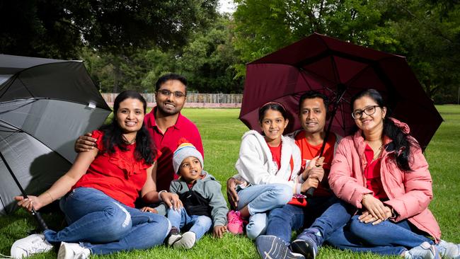 Manjula, Chandran and Ekansh Nandish, 2, with Anusha, 11, Prashanth and Shruthi Raj, from Melbourne, enjoying Botanic Park in the cold weather on Christmas Day. Picture: The Advertiser/ Morgan Sette