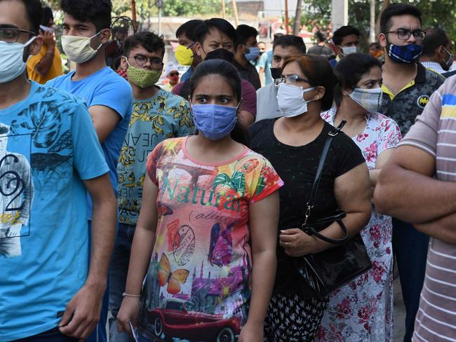 People wait for their turn to receive a dose of Covishield vaccine against the Covid-19 coronavirus at a vaccination camp in Amritsar, North India on June 5. Picture: Narinder Nanu/AFP