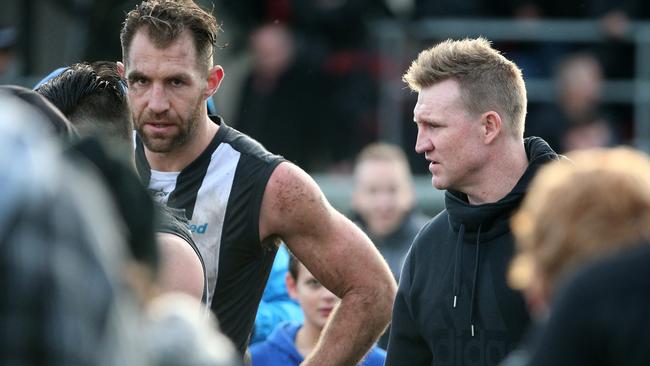 Nathan Buckley speaks with Travis Cloke during a VFL match. Picture: Mark Dadswell