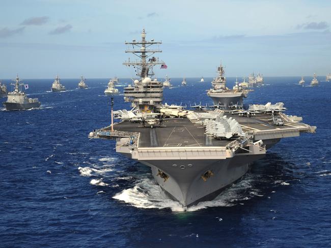 D4NHD2 US Navy Nimitz-class nuclear aircraft carrier USS Ronald Reagan leads a group of multinational ships during RIMPAC exercises July 24, 2010 in the Pacific Ocean.