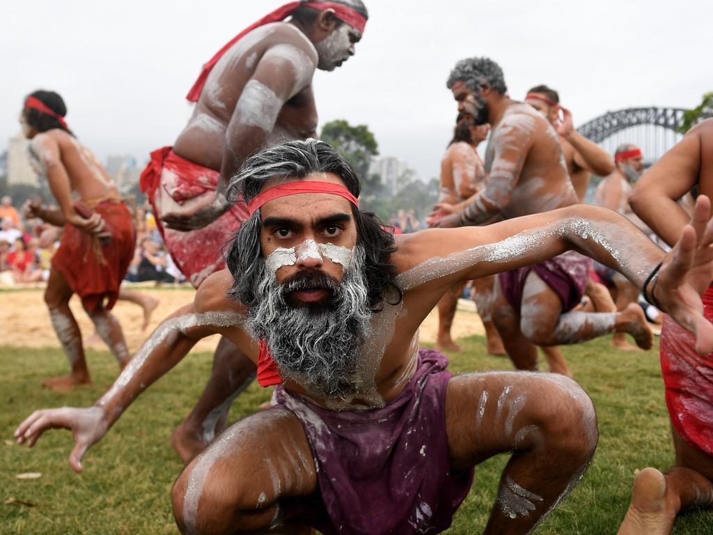 Koomurri people and representatives of aboriginal groups from around Australia perform the Smoking Ceremony and Dance during the WugulOra Morning Ceremony at Walumil Lawn at Barangaroo Reserve as part of Australia Day celebrations in Sydney, Thursday, Jan. 26, 2017. (AAP Image/Brendan Esposito)