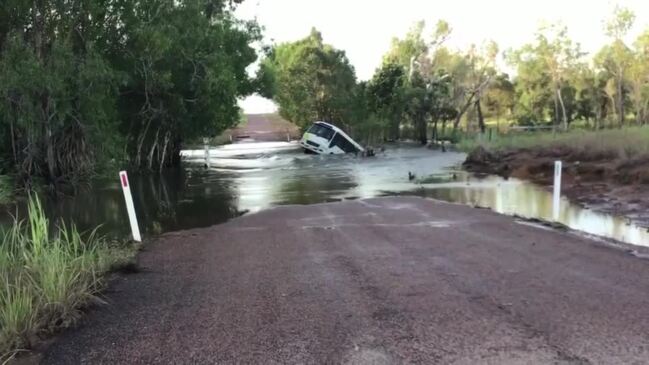 Incredible footage shows school bus swept into floodwater