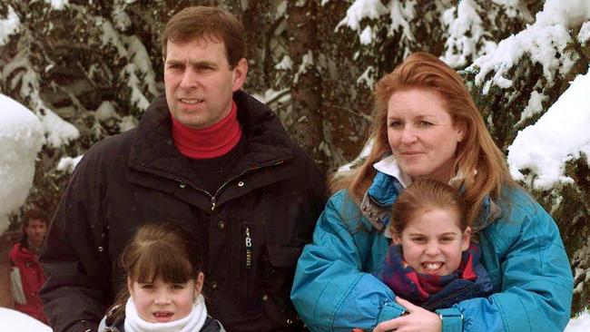 Prince Andrew and his former wife Sarah Ferguson, pose together with their daughters, Princesses Beatrice (R) and Eugenie, in the Swiss ski resort of Verbier in 1999.