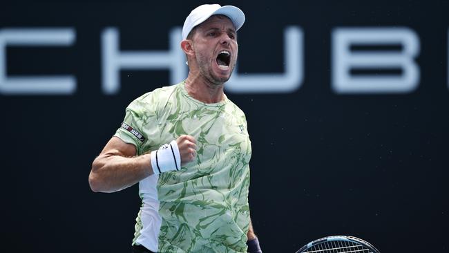 Aussie journeyman James Duckworth pumps his fist in celebration after advancing through to the second round with a straight sets victory. Picture: Hannah Peters / Getty Images