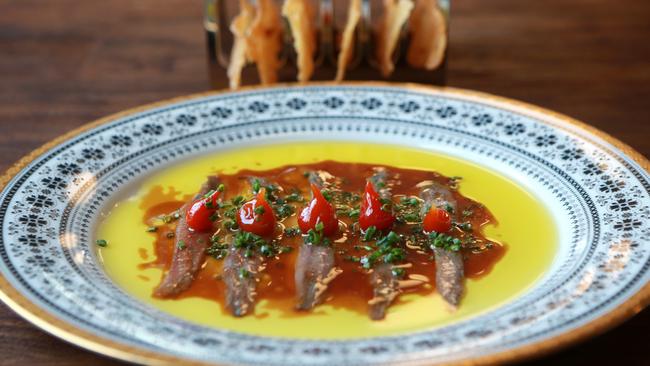 Ortiz anchovies fermented garlic honey and sherry vinegar with crisp bread. Picture: AAP/ Sarah Marshall