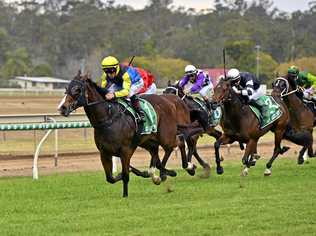 LEADING RUN: Jockey Jim Byrne guides Baby Boomer home at Ipswich racetrack. Picture: Cordell Richardson