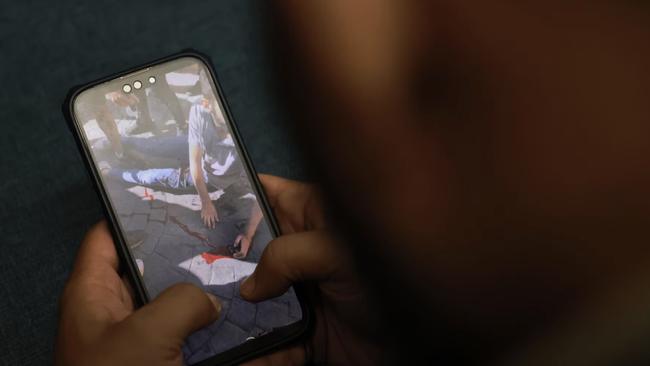 A man watches a video in the aftermath of the pager explosions. Picture: Joseph Eid/AFP/Getty Images