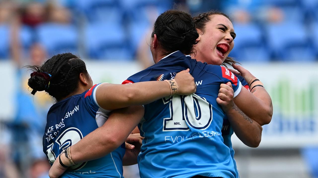 Titans players celebrate their victory over the Broncos.