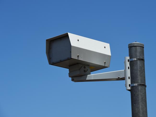 The red light speed cameras are one of 22 across the state, keeping motorists in line from running red lights and speeding. Photo: File