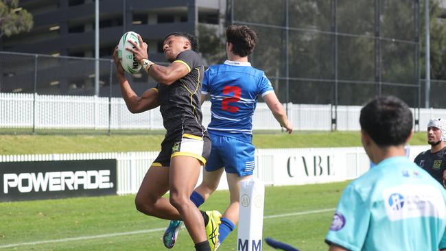 Action between St Dominic's College and Bass High School in round one of the Peter Mulholland Cup at Ringrose Park. Picture: Tim Hunter