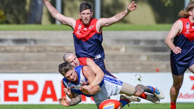 Lockley’s Ryan Langcake tackles Kenilworth’s Nathan Ryles and is backed up by Michael Corbett. Picture: Brenton Edwards