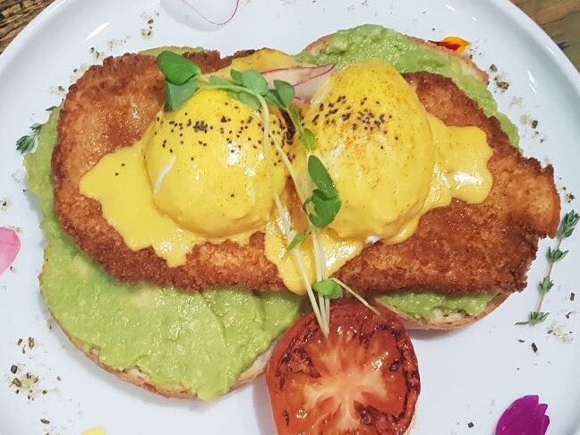 One Little Tree Cafe puts an Aussie pub feed twist on its eggs benedict with a chicken schnitzel option. 