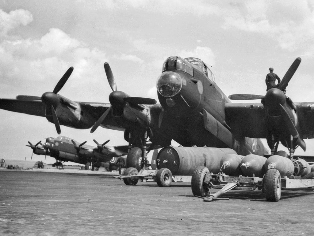 Lincolnshire, England. c. 1944-07. an avro Lancaster heavy bomber aircraft of No. 460 squadron RAAF at RAF station Binbrook being bombed up for operations.