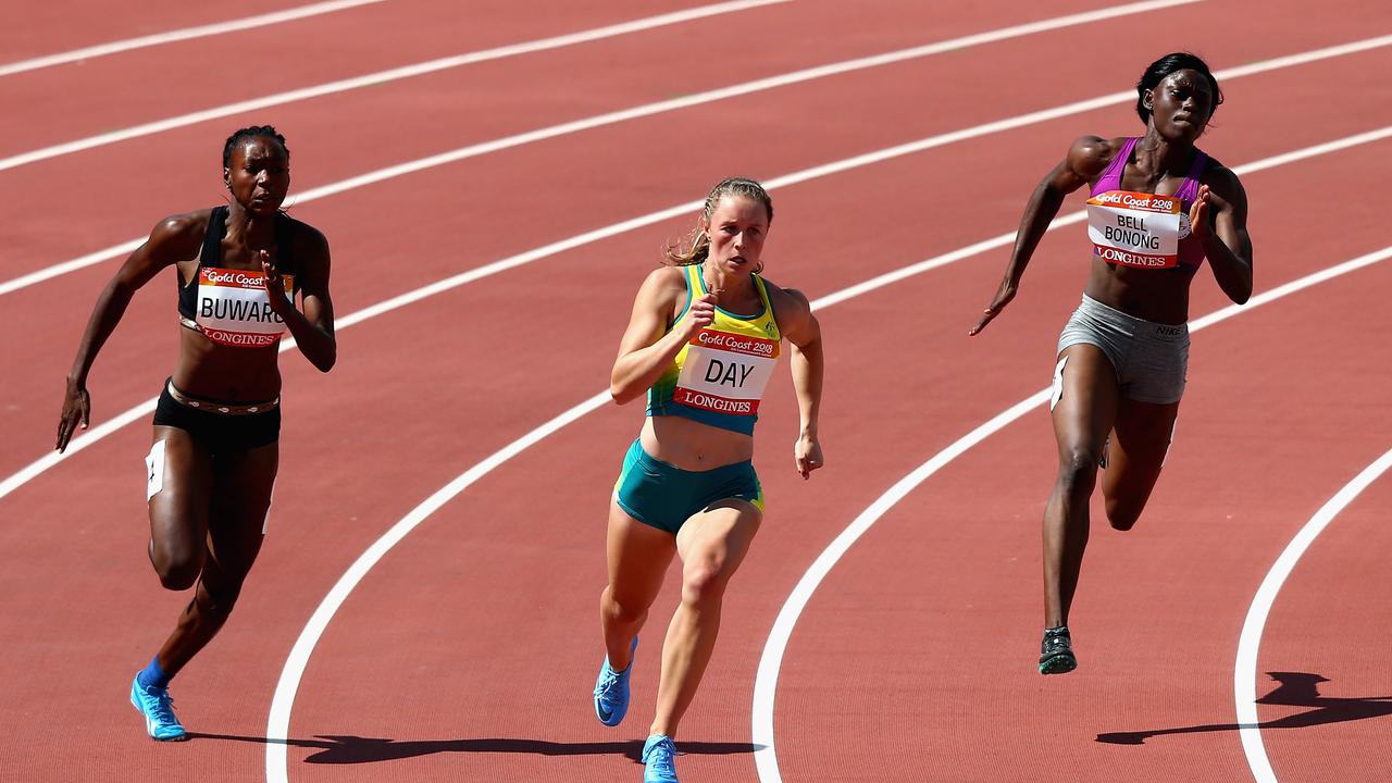 Ola Buwaro of Gambia, Riley Day of Australia and Irene Bell Bonong of Cameroon compete in the Women's 200 metres heats.