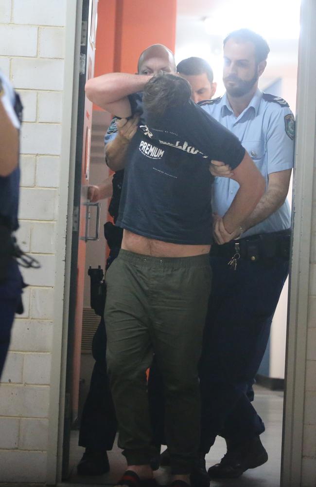 One of the alleged scammers at Kogarah police station. Picture: John Grainger