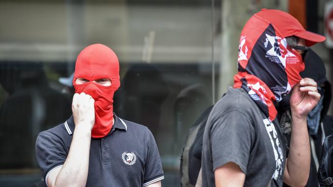 Masked Antifa members march in Melbourne. Picture: Jake Nowakowski