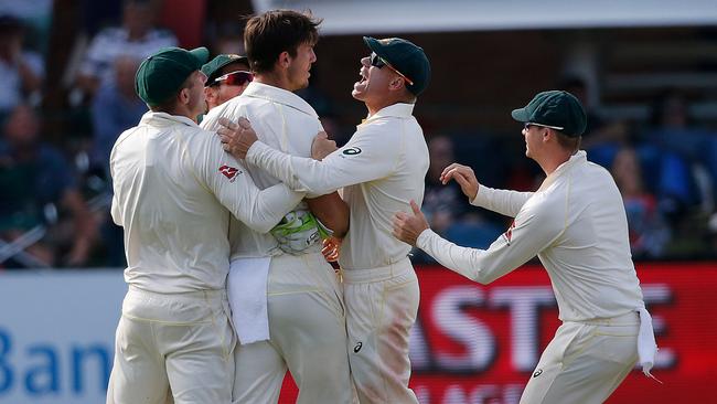 Mitch Marsh is swamped by team-mates after removing Faf du Plessis. Picture: AFP