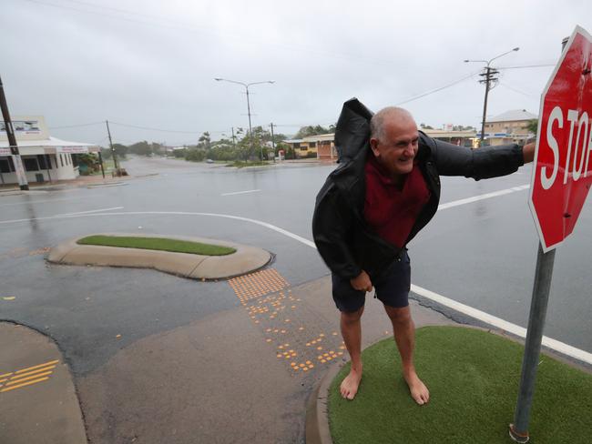 Evacuated local Bob Morton braces against the strong wind in Bowen. Picture: Lyndon Mechielsen/The Australian