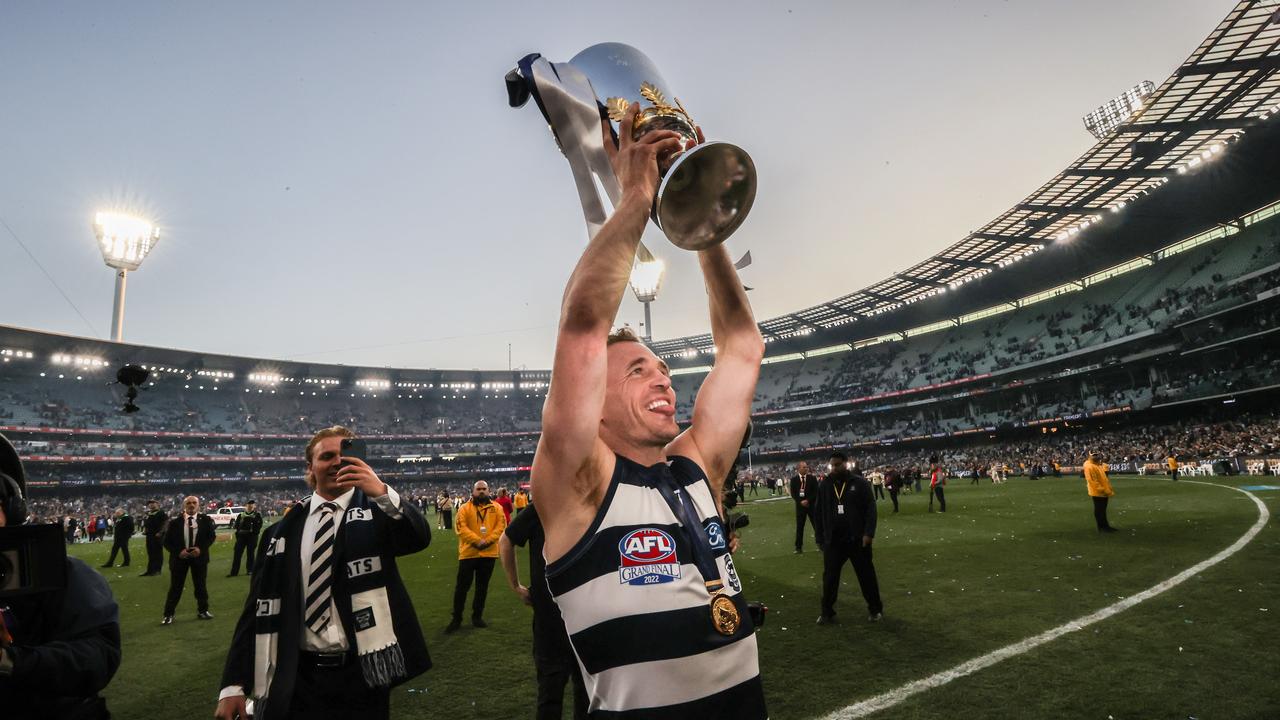 Geelong Cats captain Joel Selwood celebrates with the Premiership Cup to the supporters. Picture: David Caird