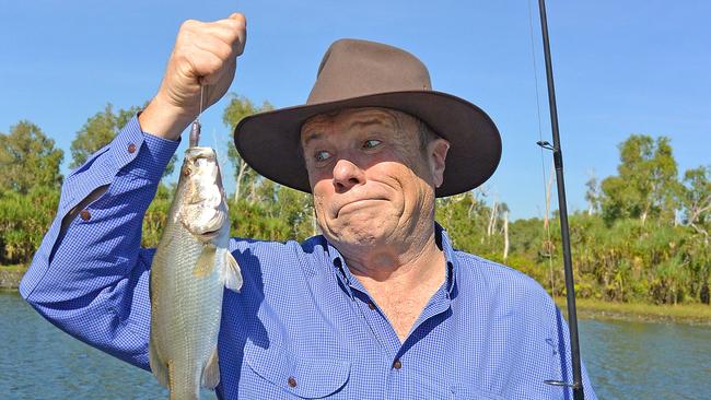 Charles Wooley catches a barramundi while fishing at Four Mile Hole in Kakadu. SUPPLIED