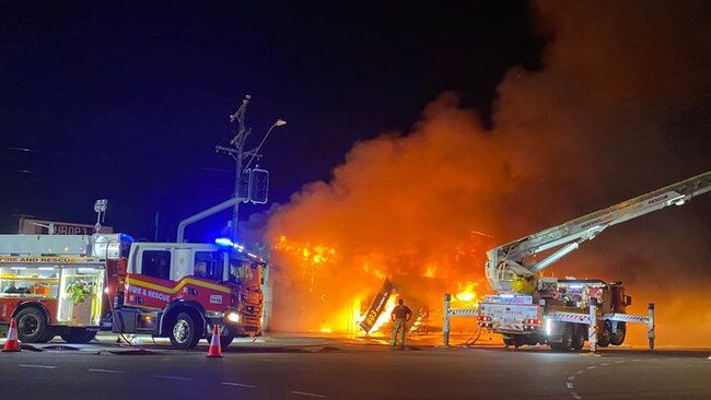 Fire fighters battle the large inferno that engulfed Croft Auto on Sheridan St, Cairns North, May 31. Picture: QPS