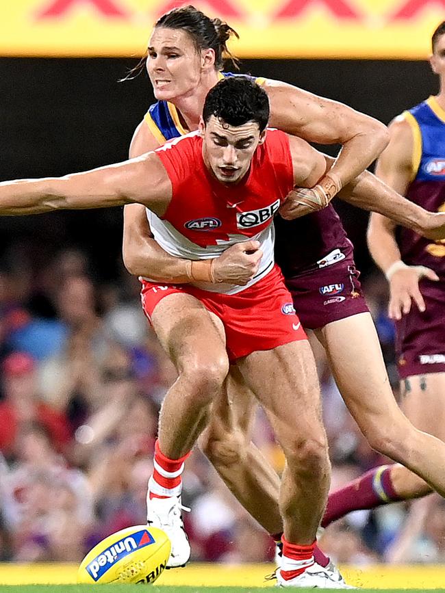 Tom McCartin battles with Eric Hipwood during the Swans Round 1 win over the Lions. Picture: Bradley Kanaris/Getty Images